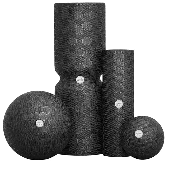 Liebscher & Bracht set in patterned black: two rollers, the larger grooved round its middle, and two balls