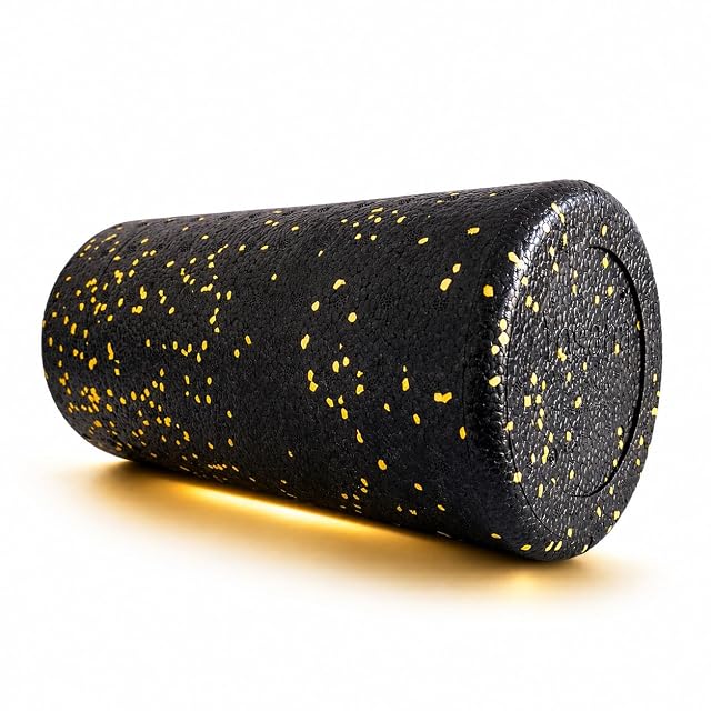 Yosana foam roller in black flecked with yellow, stood on end with the seam of its closed face showing