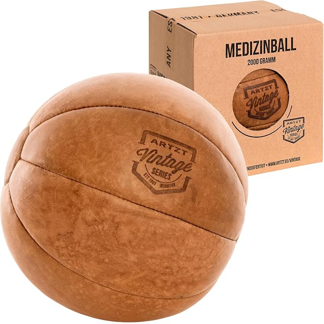 ARTZT Vintage Series tan leather medicine ball with a burned-in crest, beside a kraft box reading 2000 GRAMM